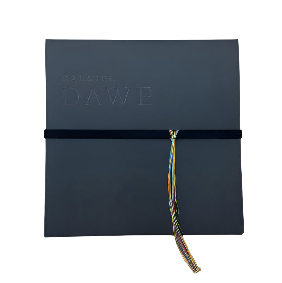 Black diploma cover with 'Gabriel Dawe' branding and a colorful tassel on a white background